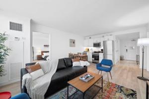 a living room with a couch and a table at Astonishing Ocean Front Condo CozySuites at Showboat in Atlantic City