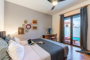 a bedroom with a bed with a view of the ocean at Apartments LOTA with heated pool on top location in Supetar