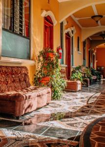 a couch sitting on the side of a building at Hotel Casa Texel in Panajachel