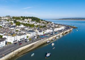 an aerial view of a town with boats in the water at Whimbrel Cottage in Appledore