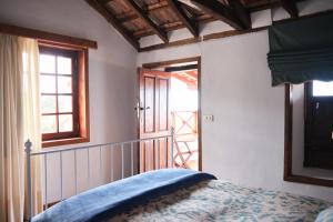 Łóżko lub łóżka w pokoju w obiekcie Casa Rural Felipe Luis