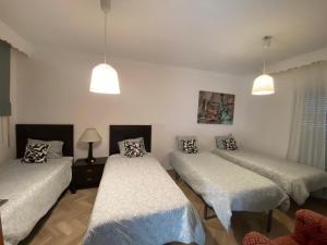 Postel nebo postele na pokoji v ubytování Casa Delfina + 37 fotografií