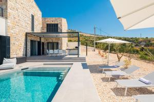 a villa with a swimming pool and a patio at Villa Axel in Primošten