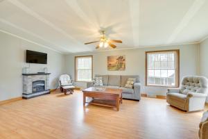 a living room with a couch and a table at Cozy Midcoast Vacation Rental Near Waterville! 