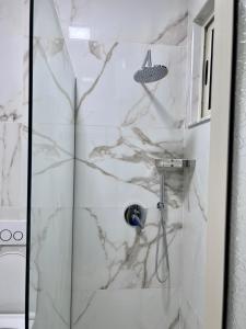 Vannituba majutusasutuses Perdja Apartment I
