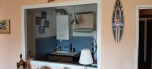 a kitchen with a sink and a counter top at Cosy in Saint-Jean-de-Luz