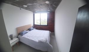 Llit o llits en una habitació de Edificio Flats del sol