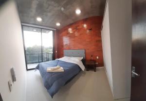 Llit o llits en una habitació de Edificio Flats del sol