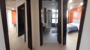 Llit o llits en una habitació de Edificio Flats del sol