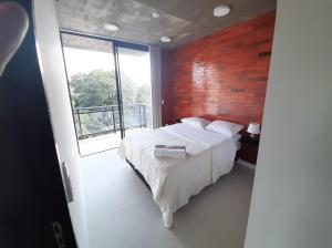 Llit o llits en una habitació de Edificio Flats del sol