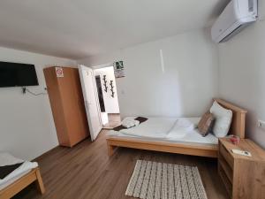 Postel nebo postele na pokoji v ubytování Apartmani - Kladovski Konak