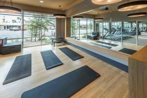a yoga room with a row of yoga mats at Modern CozySuites - paradise under the palm trees! in Phoenix