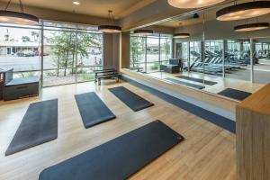 a yoga room with a row of yoga mats at Paradise Cozysuites Under the Palms with jacuzzi 18 in Phoenix