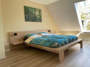 Postel nebo postele na pokoji v ubytování B&B Bosstee