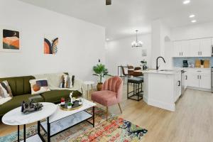 a living room and kitchen with a couch and a table at TWO Cozysuites with Pool Jacuzzi in Glendale 10&03 in Glendale