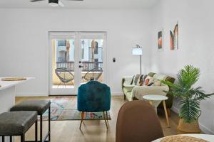 a living room with a couch and a table at CozySuites Glendale by the stadium with pool 03 in Glendale +26 photos