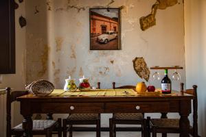 a table in a room with a car on the wall at Chiantissima, Tuscany in Starda