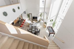 an overhead view of a living room and dining room at Modern Penthouse on Mass By CozySuites in Indianapolis