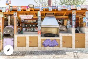 a kitchen with a stove top oven inside of a building at בקתה ואירוח היסמין מול הנוף in Majdal Shams