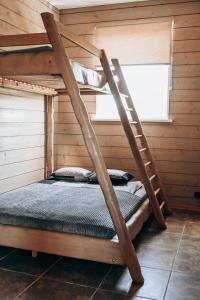 a room with two bunk beds in a cabin at VERTIKĀLES in Liepāja