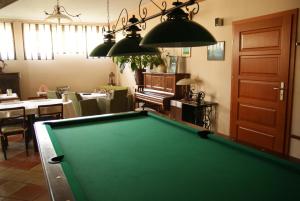 a pool table in the middle of a living room at Willa Wiosna in Września