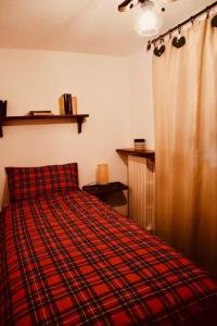 Llit o llits en una habitació de Maison Baradis - grazioso e tranquillo trilocale con vista montagne