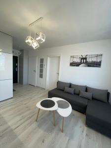 a living room with a couch and a table at N° 60 in Płock