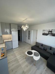 a living room with a couch and a table at N° 60 in Płock