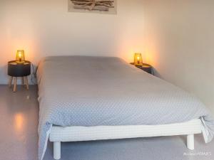 Łóżko lub łóżka w pokoju w obiekcie Appartement T3 avec balcon proche commodités, parking inclus - FR-1-349-198
