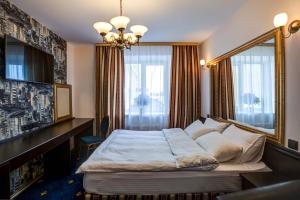  Кровать или кровати в номере Бутик отель Гранд 