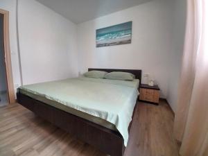 a bedroom with a bed in a room at Sol in Kremena
