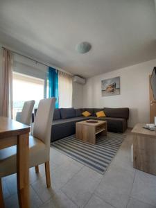 a living room with a couch and a table at Sol in Kremena