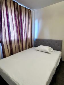 מיטה או מיטות בחדר ב-Simple Deluxe Private Room