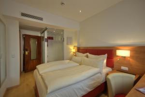 Cama ou camas em um quarto em Hotel Condor