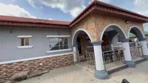 a brick building with arched windows and a balcony at Apt001 in Okinni