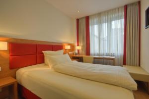 Cama ou camas em um quarto em Hotel Condor