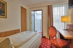 Cama ou camas em um quarto em Hotel Condor