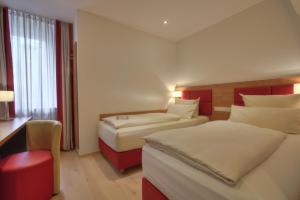 Cama ou camas em um quarto em Hotel Condor