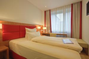 Cama ou camas em um quarto em Hotel Condor