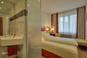 Cama ou camas em um quarto em Hotel Condor