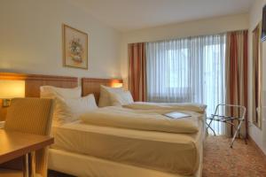Cama ou camas em um quarto em Hotel Condor