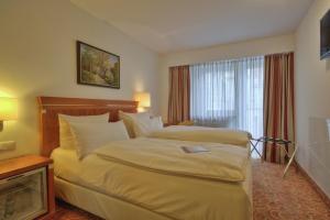 Cama ou camas em um quarto em Hotel Condor