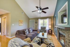 a living room with a couch and a fireplace at Cozy Resort-Style Escape on Taylorsville Lake! in Taylorsville