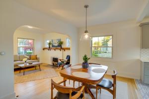 a kitchen and living room with a table and chairs at Indiana Vacation Rental - Walk to Syracuse Lake! in Syracuse