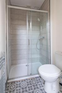 a bathroom with a shower and a toilet at RESIDENCY LUXURY SEAFRONT HOTEL in Blackpool
