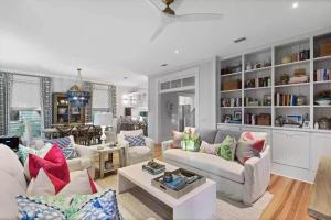 a living room with two couches and a table at Southern Charm in Santa Rosa Beach