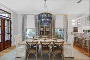 a dining room with a table and chairs at Southern Charm in Santa Rosa Beach