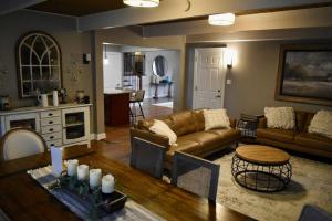 a living room with a couch and a table at Glen Ellyn Countryside Home in Glen Ellyn
