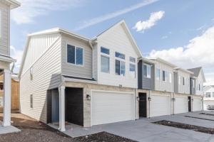 a large white house with a garage at Brand New Garden City 3BR 2BA BOAT PARKING in Garden City