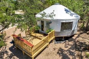 an aerial view of a yurt with a porch and a bench at Luxury Yurt, Alpacas and llamas near Downtown Wimberley and Wineries in Wimberley